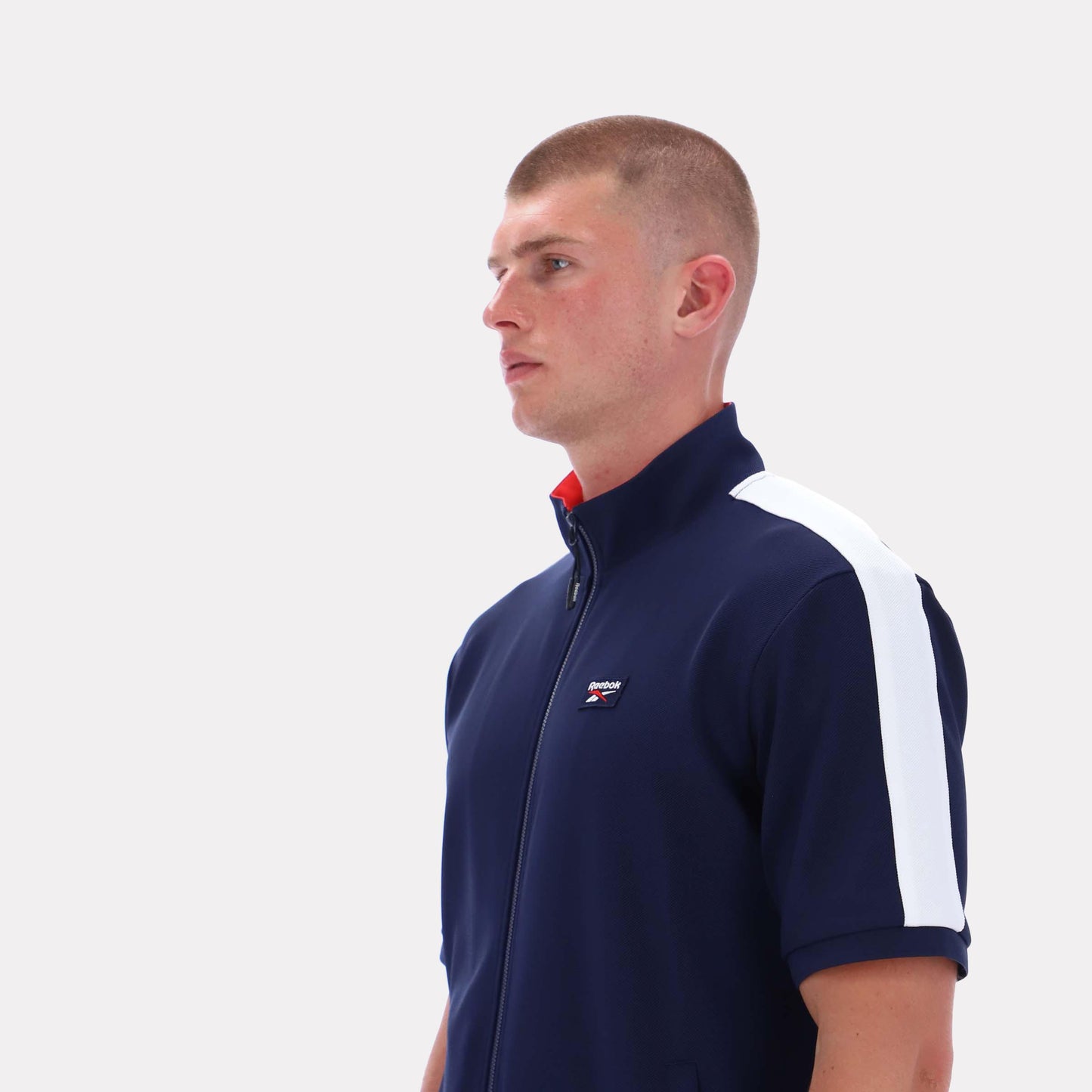 Reebok Apparel Men Short Sleeve Track Zip Shirt VECTOR NAVY