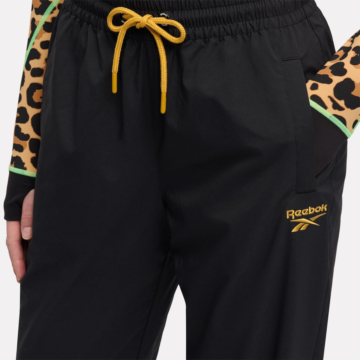 REEBOK APPAREL WOMEN Animal Print Vector Track Pants BLACK