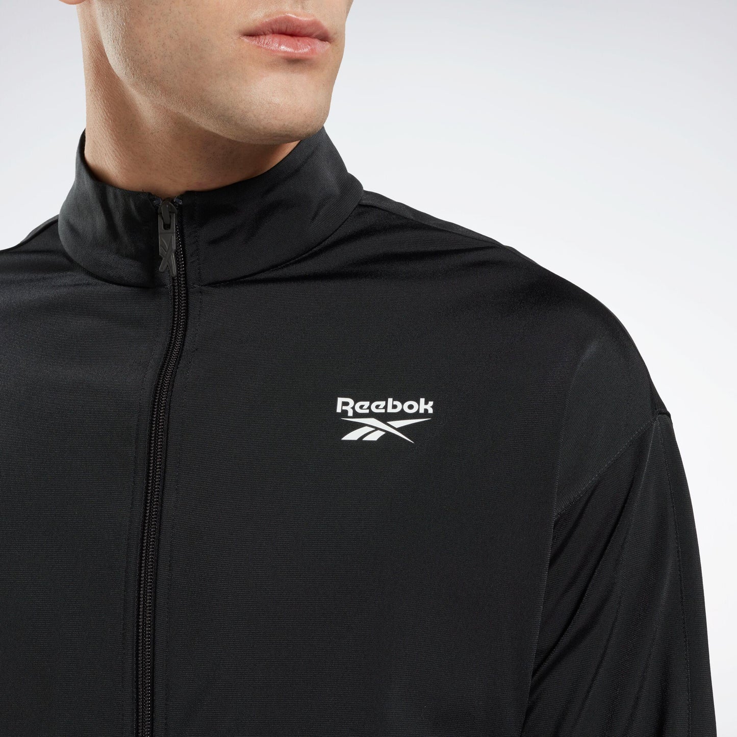 Reebok Apparel Men Reebok Identity Vector Knit Track Jacket NIGHT BLACK/WHITE