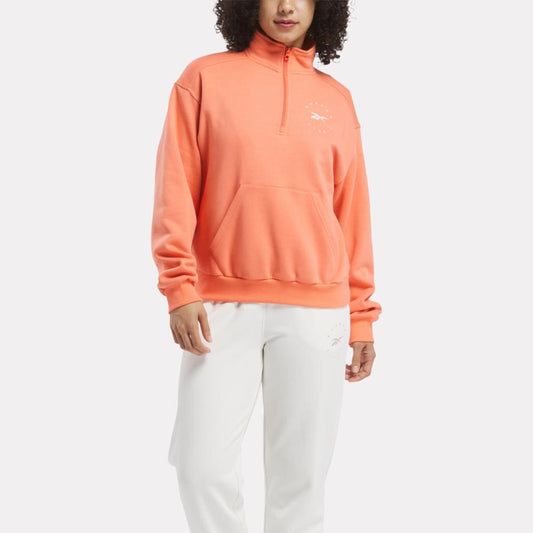 Reebok Apparel Women ID Energy Fleece Midlayer Top SUPERCHARGED CORAL