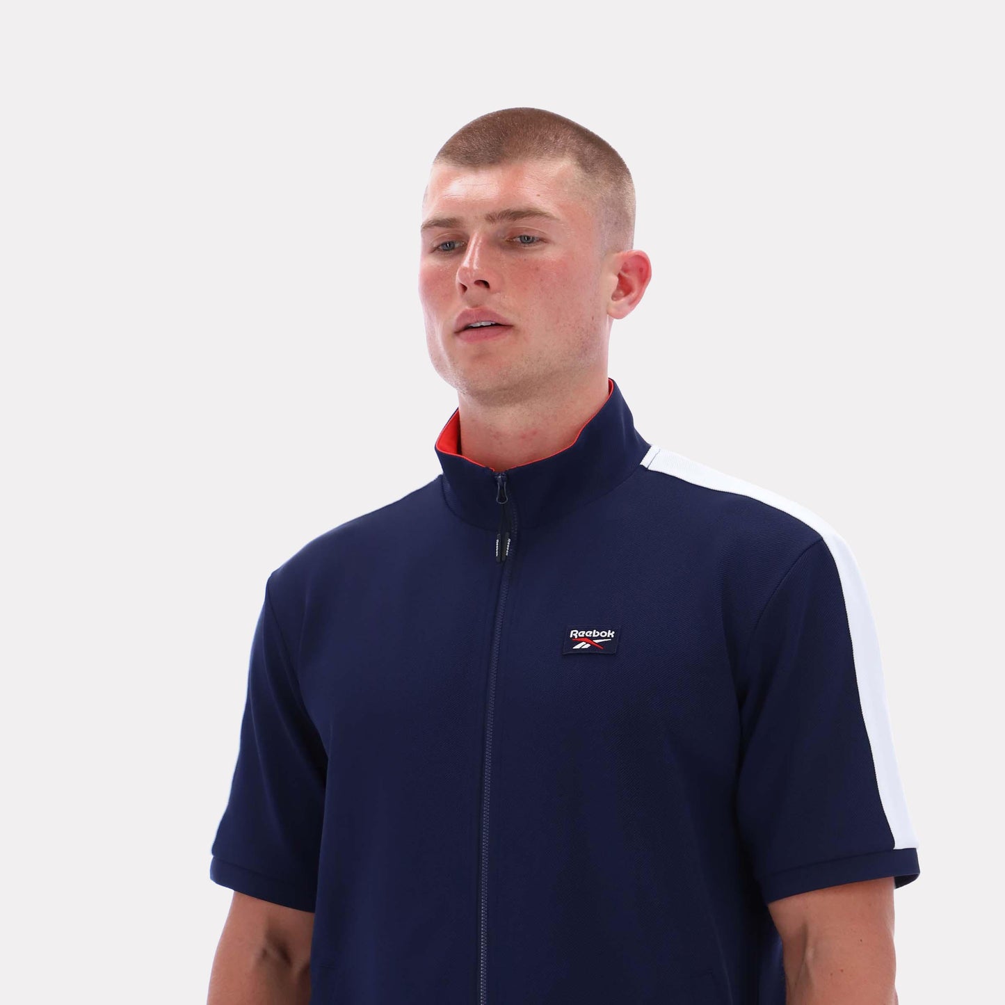 Reebok Apparel Men Short Sleeve Track Zip Shirt VECTOR NAVY