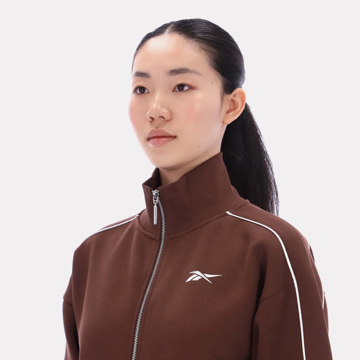 Reebok Apparel Women Off-Duty Cropped Jacket CAMPUS BROWN