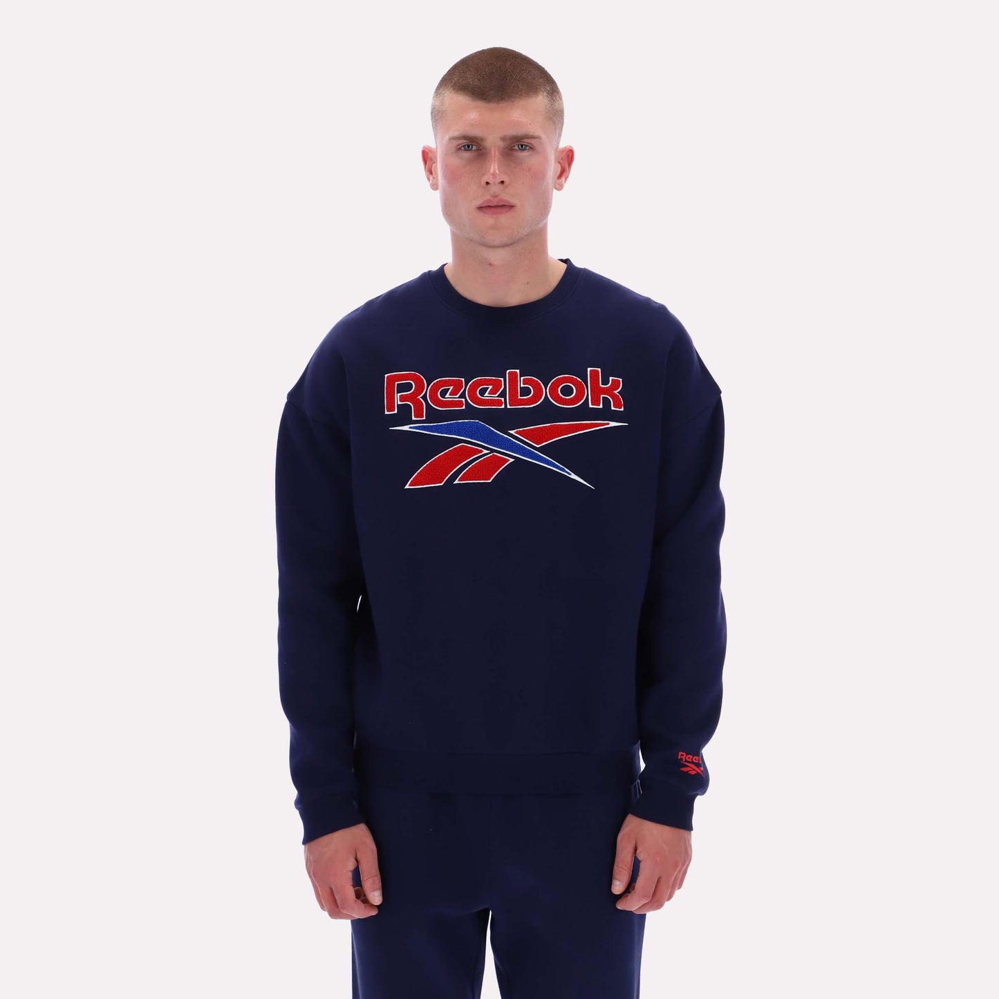 Reebok Apparel Men Varsity Graphic Sweatshirt VECTOR NAVY