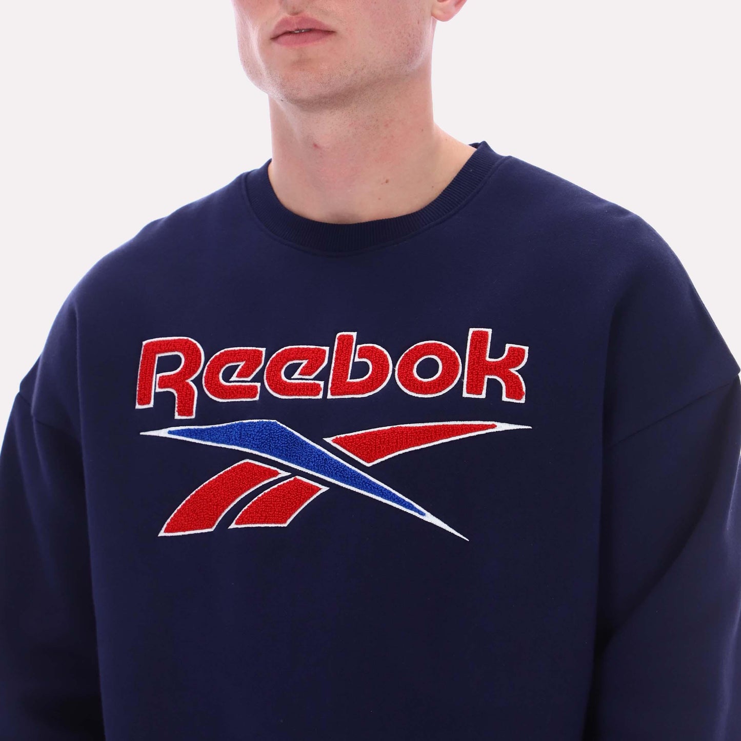 Reebok Apparel Men Varsity Graphic Sweatshirt VECTOR NAVY