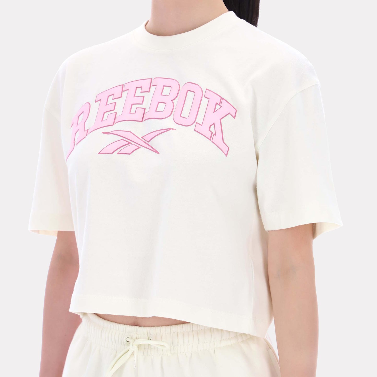Reebok Apparel Women Varsity Logo Cropped T-Shirt VINTAGE CHALK