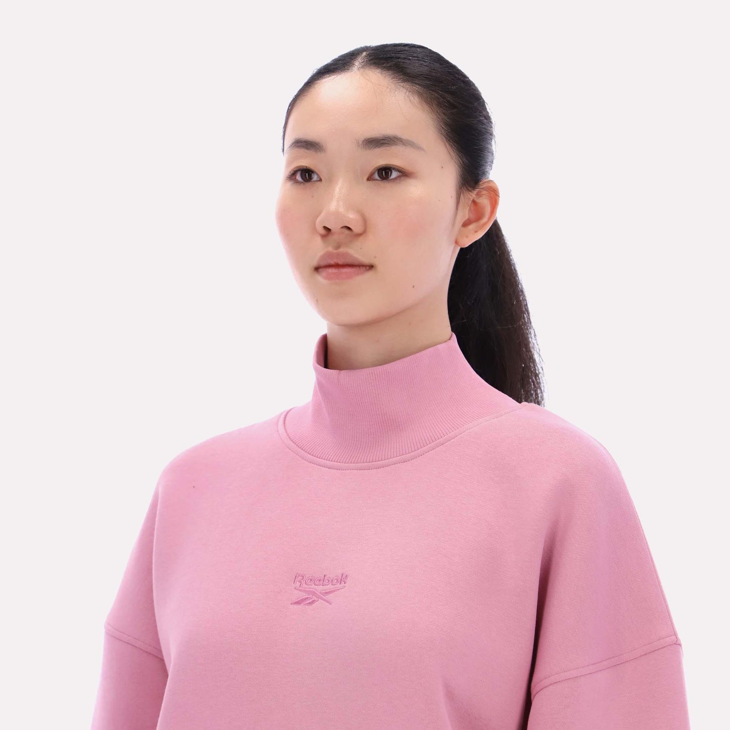 Reebok Apparel Women  Longline Roll Neck Sweatshirt DUSTY ROSE