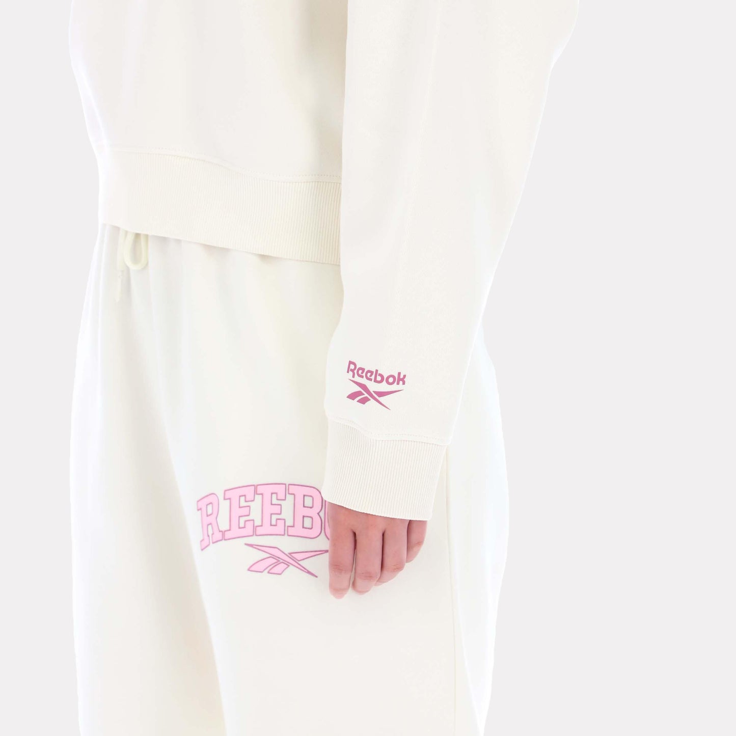 Reebok Apparel Women Varsity Logo Cropped Graphic Hoodie VINTAGE CHALK