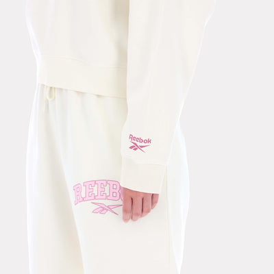Reebok Apparel Women Varsity Logo Cropped Graphic Hoodie VINTAGE CHALK