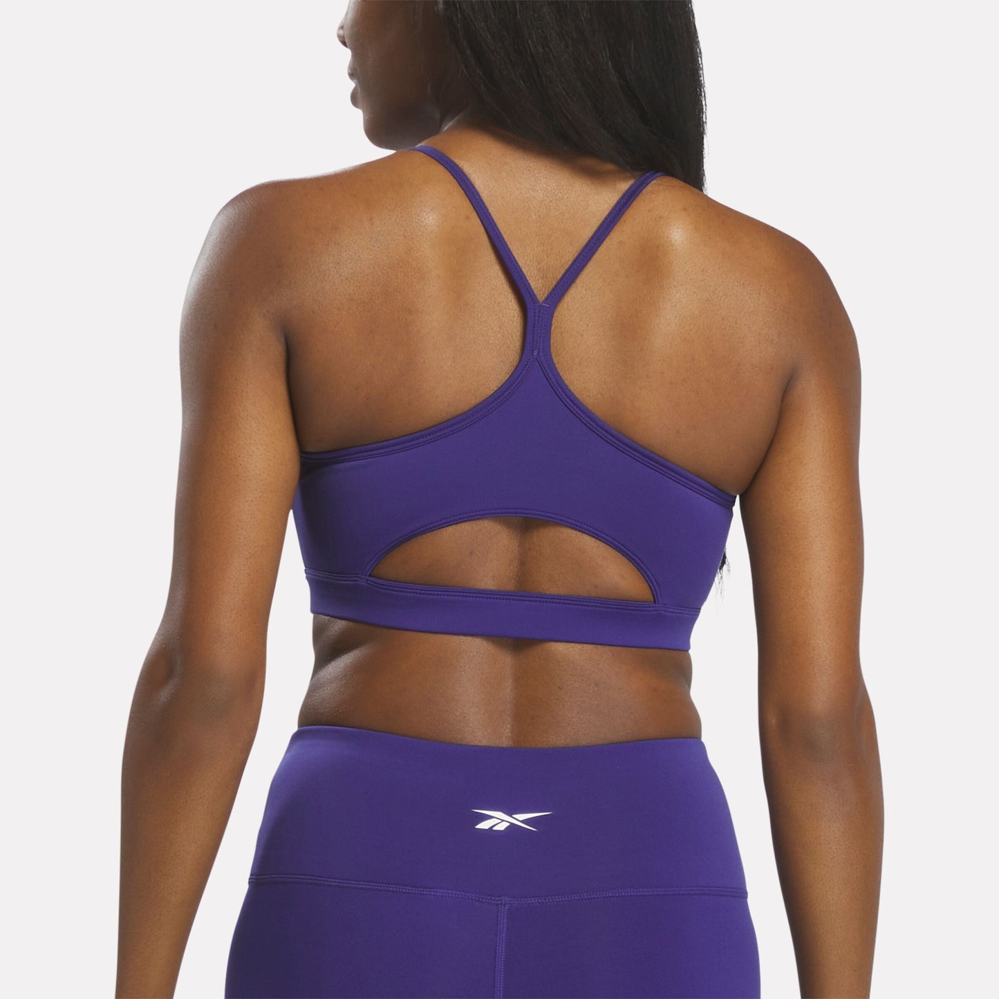 REEBOK APPAREL WOMEN Strappy Sports Bra BOLD PURPLE