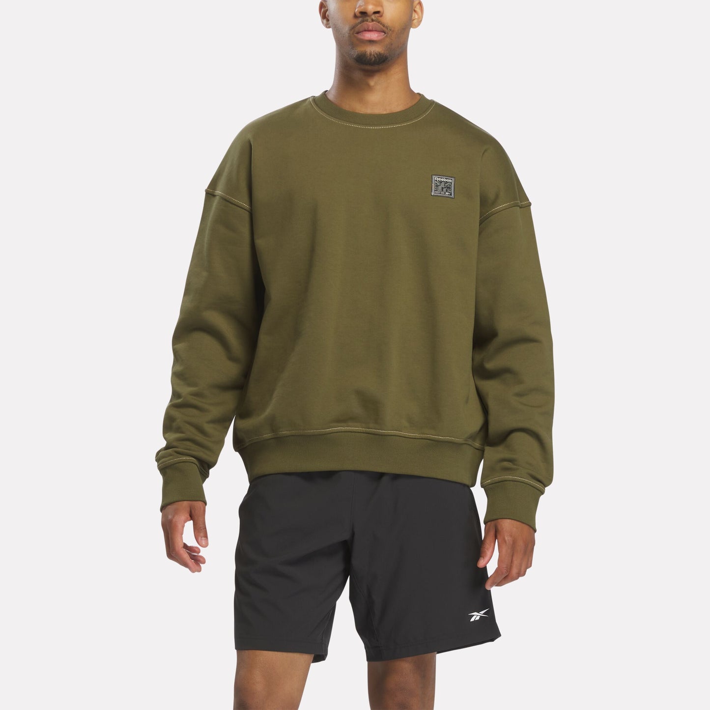 REEBOK APPAREL MEN Forge Standard Patch Logo Crewneck Sweatshirt OLIVE STONE