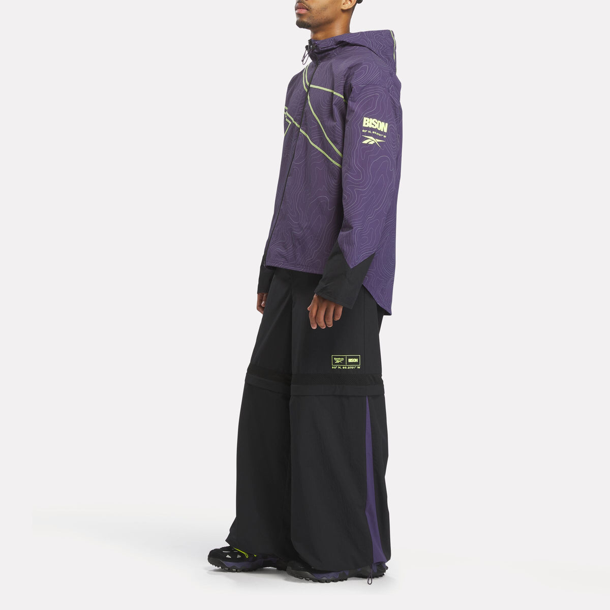 REEBOK APPAREL UNISEX Reebok x A Herd of Bison Packable Jacket MOVEMENT PURPLE/BLACK/DIGITAL LIME