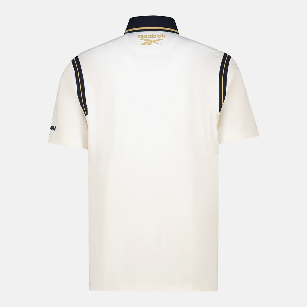 REEBOK APPAREL MEN Crushers GC Varsity Short Sleeve Polo CHALK/GOLD/VECTOR NAVY