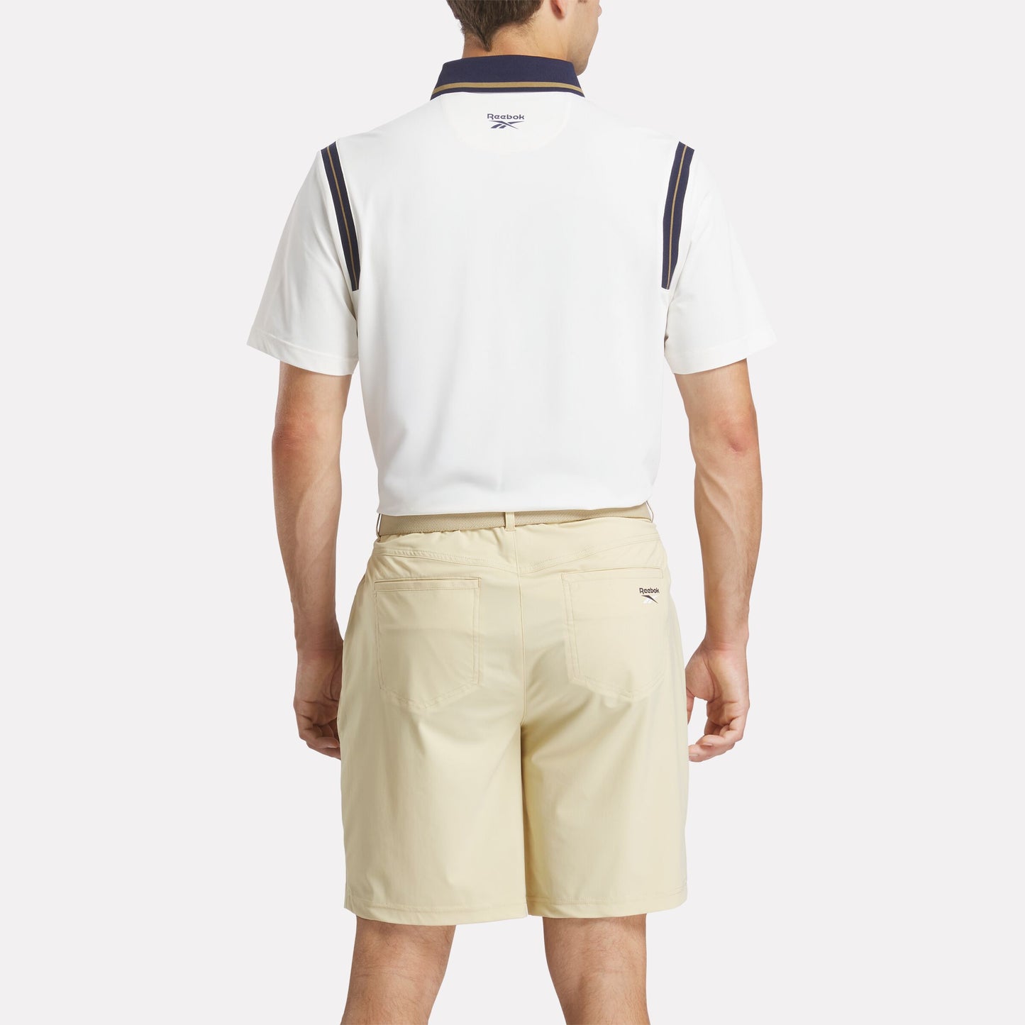 REEBOK APPAREL MEN Varsity Golf Short Sleeve Polo CHALK/GOLD/VECTOR NAVY