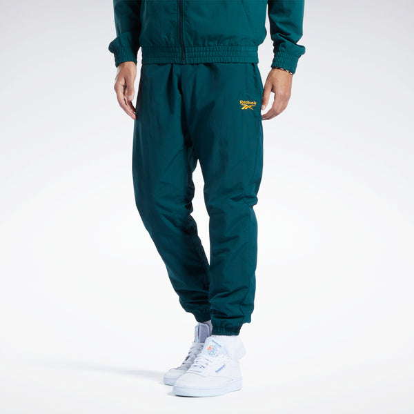 Reebok Embroidered Logo Joggers in Dark green. Chalk embroidery